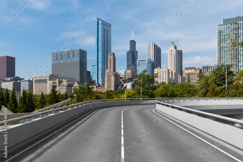 Empty urban asphalt road exterior with city buildings background. New modern highway concrete construction. Concept of way to success. Transportation logistic industry fast delivery. Chicago. USA. © VideoFlow