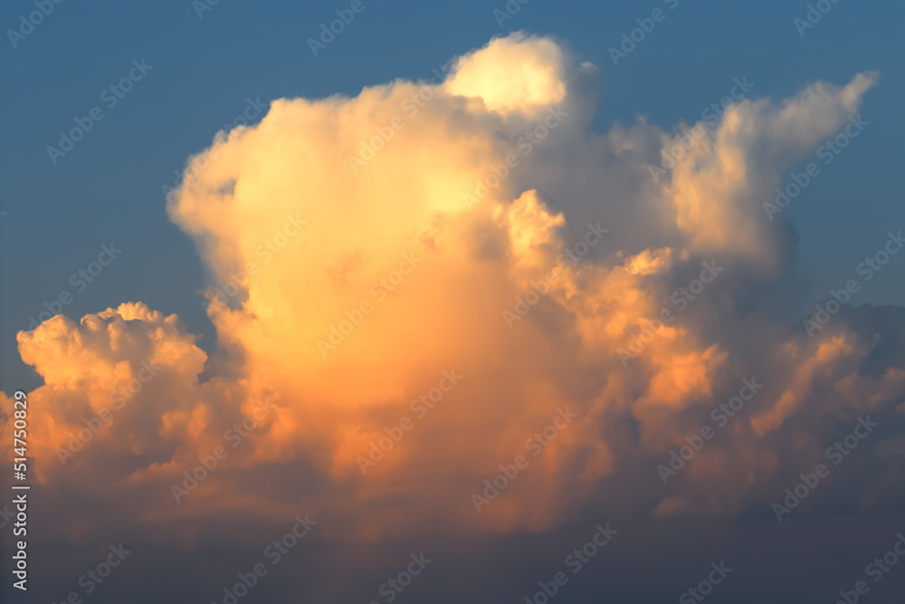 Cumulonimbus large orange cloud in the evening, sunset Cumulonimbus large orange cloud in the evening, sunset
