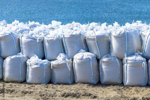Large sandbags, by the sea, flood protection