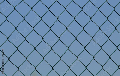 chain link fence with blue sky