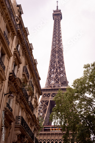 Photograph of the eiffel tower on a street in paris