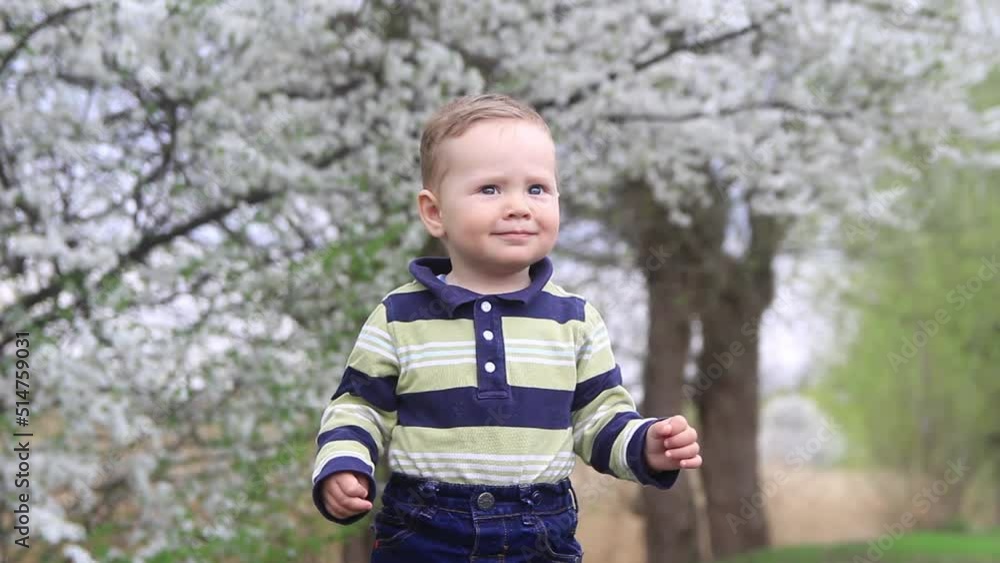 A child on nature close-up, smiling looking. A child on nature close-up, smiling looking.