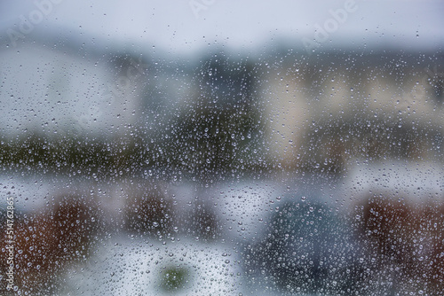 Beautiful macro view from room on raindrops on glass. Sweden. © Alex