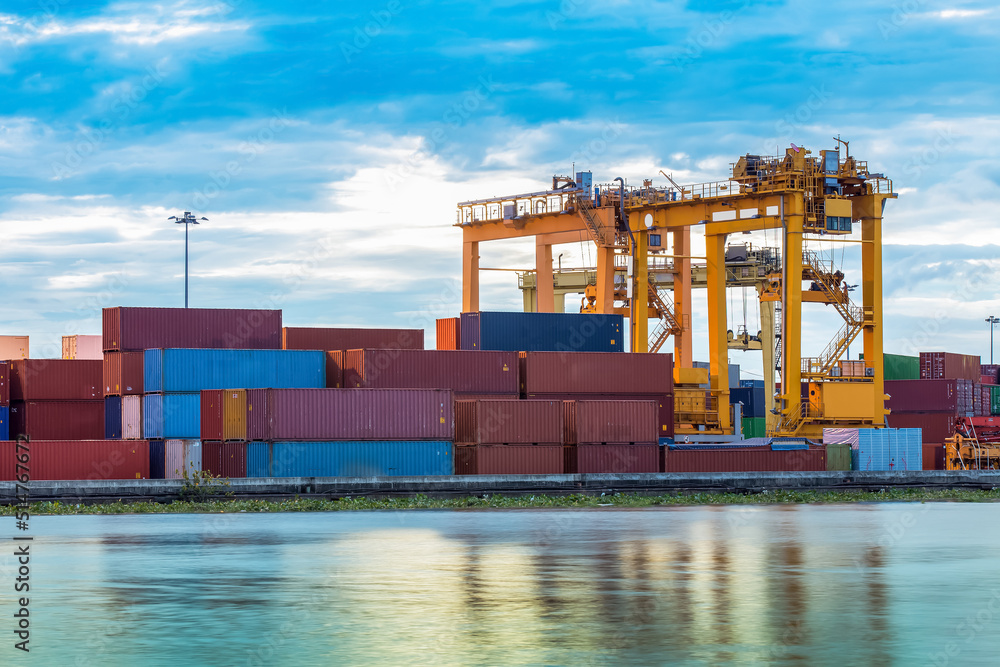 Fotografie Industrial crane with Containers for Loading to a Cargo freight ship