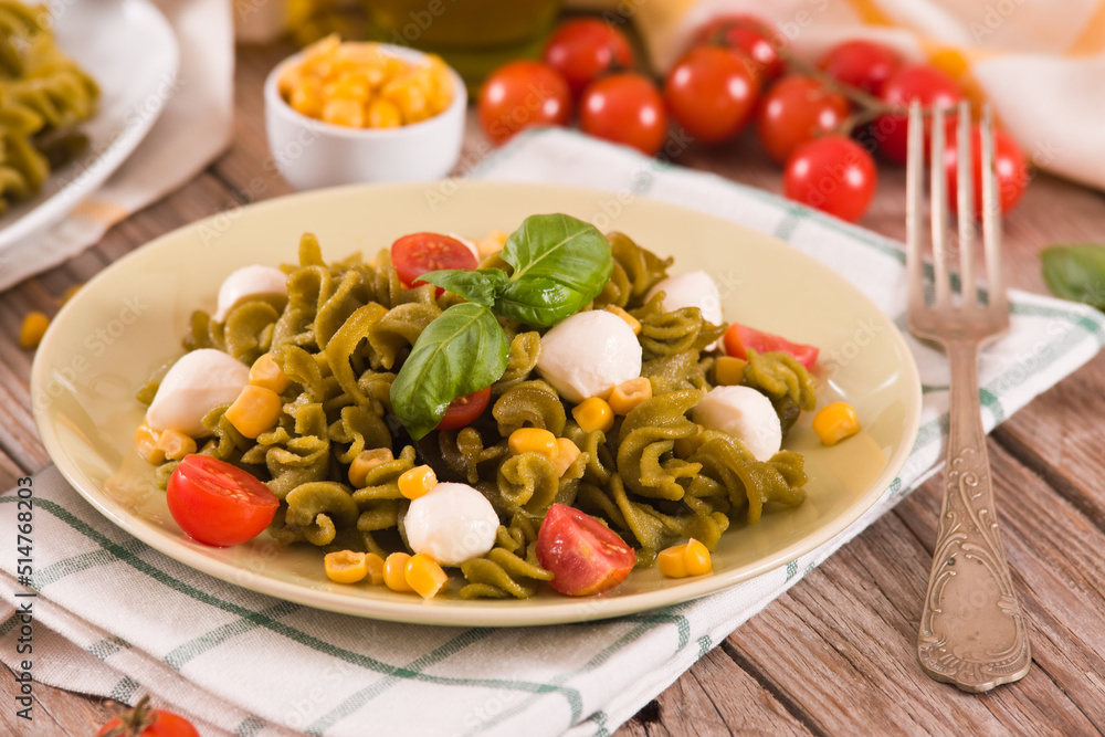 Fusilli pasta with cherry tomatoes and sweet corn. Fusilli pasta with cherry tomatoes and sweet corn.