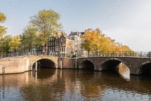 Canal houses and the typical stone bridges over the canals in the center of Amsterdam.