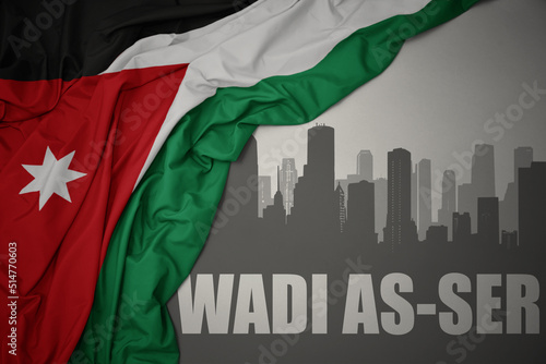 abstract silhouette of the city with text Wadi as-Ser near waving national flag of jordan on a gray background.3D illustration