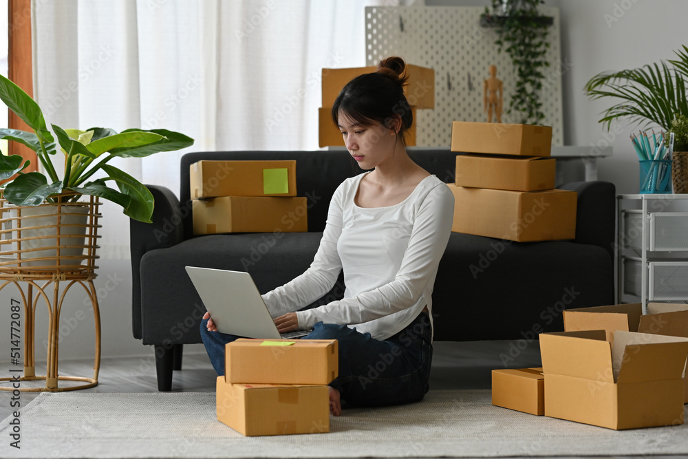 Business SME owners working with laptop SME or Selling online business and Delivery concept. Business SME owners working with laptop SME or Selling online business and Delivery concept.