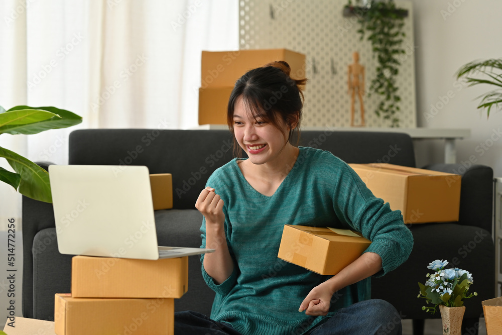 Happy successful SME entrepreneur with arms up, Home office, Business online and Delivery, Selling online, Startup small business concept. Happy successful SME entrepreneur with arms up, Home office, Business online and Delivery, Selling online, Startup small business concept.