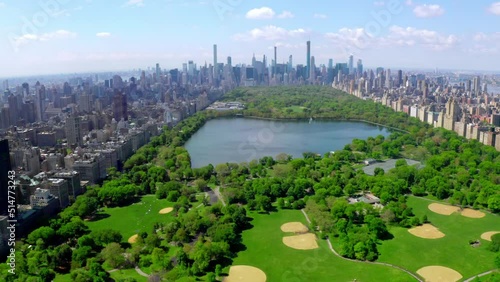 Aerial 4k video above green Central park in the middle of Manhattan, New York City during summer time. Beautiful New York city from above. photo