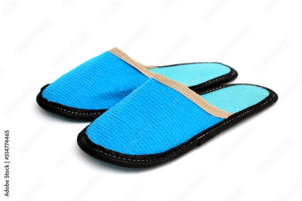 Blue textile slippers with turquoise insole, house slippers isolated on white background, home clothes Blue textile slippers with turquoise insole, house slippers isolated on white background, home clothes