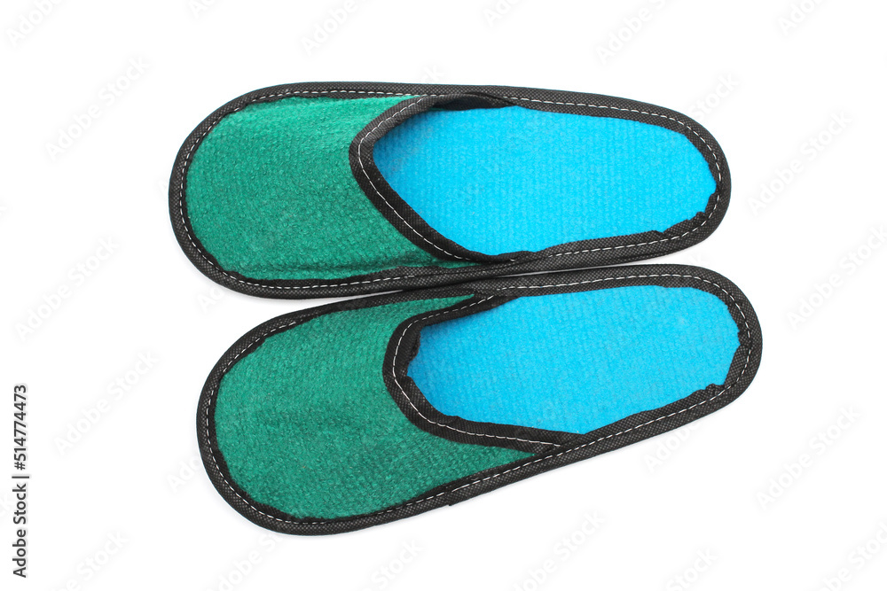 Green textile slippers with a turquoise insole, house slippers isolated on white background, home clothes, top view Green textile slippers with a turquoise insole, house slippers isolated on white background, home clothes, top view