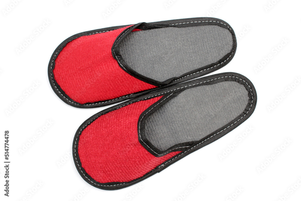 Red textile slippers with a gray insole, house slippers isolated on white background, home clothes, top view Red textile slippers with a gray insole, house slippers isolated on white background, home clothes, top view