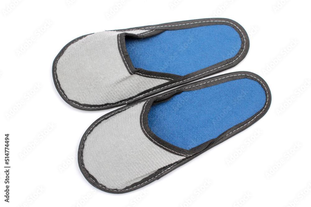 Gray textile slippers with blue insole, house slippers isolated on white background, home clothes, top view Gray textile slippers with blue insole, house slippers isolated on white background, home clothes, top view