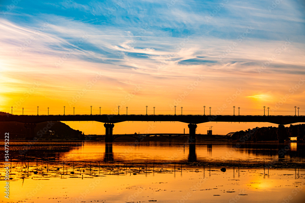 Fototapeta premium Beautiful Ukrainian sky with bridge on background. Blue and yellow color heaven.