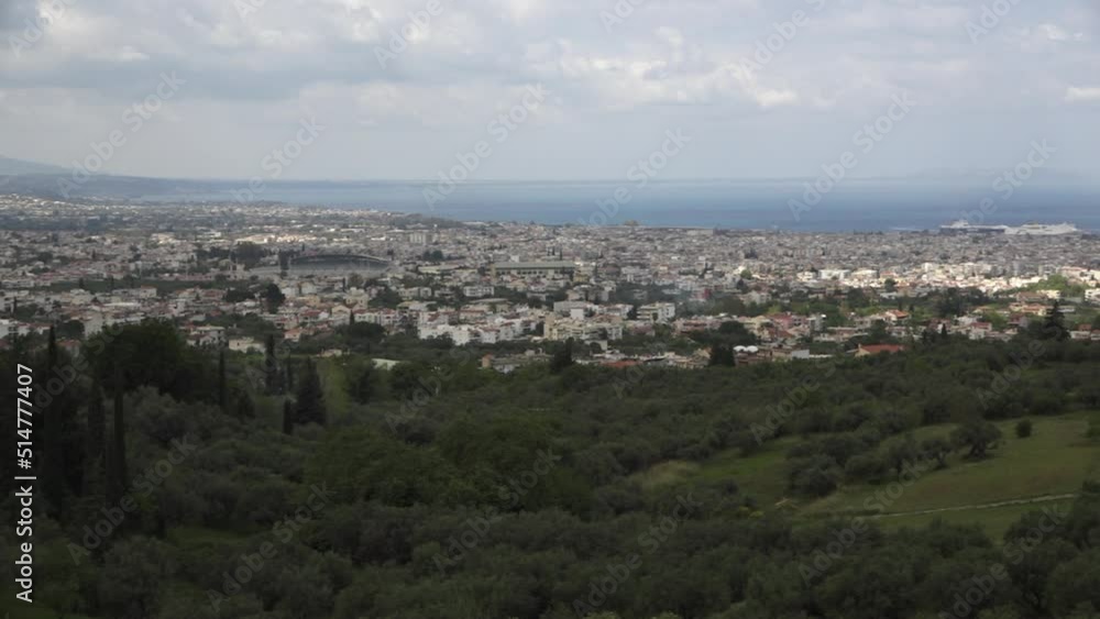 A panoramic view, with a camera movement from left to right, above a Mediterranean city on a cloudy day. Patras, Greece. A panoramic view, with a camera movement from left to right, above a Mediterranean city on a cloudy day. Patras, Greece.
