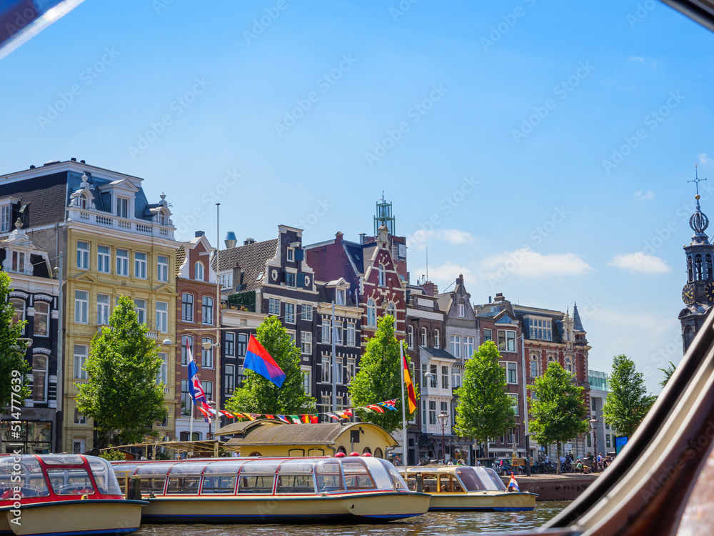 Fototapeta premium Amsterdam houses and river in the city