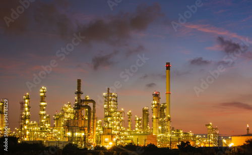 Oil​ refinery​ and​ plant and tower of Petrochemistry industry in oil​ and​ gas​ ​industry with​ cloud​ blue​ ​sky the morning​ © chitsanupong