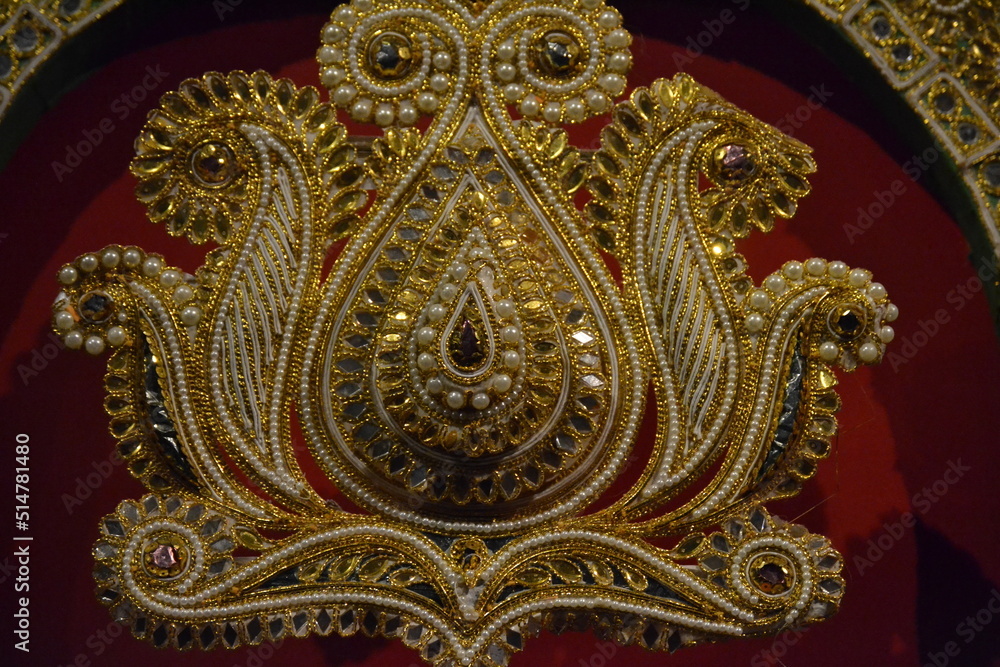 Fototapeta premium jeweler in golden yellow and diamond-like stones
