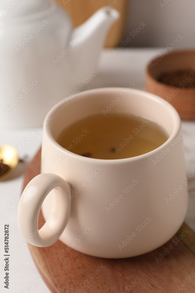 Cup of aromatic buckwheat tea on table, closeup Cup of aromatic buckwheat tea on table, closeup