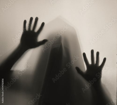 Shadowy figure, ghost behind glass - horror background