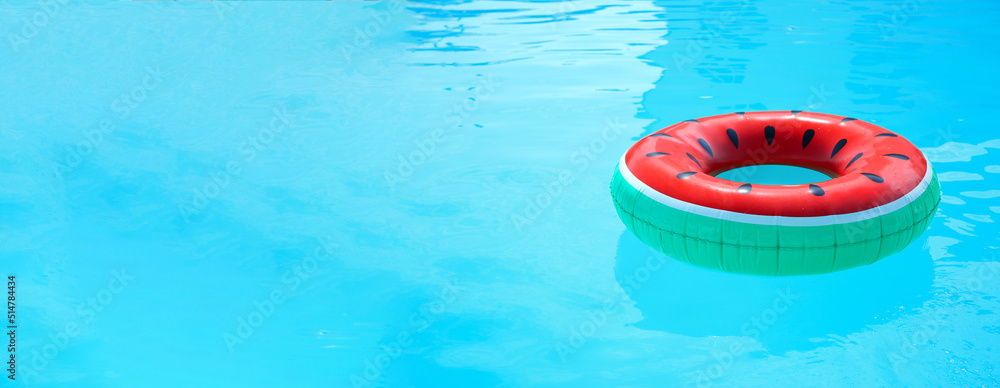 Inflatable ring in swimming pool on sunny day, space for text. Banner design Inflatable ring in swimming pool on sunny day, space for text. Banner design
