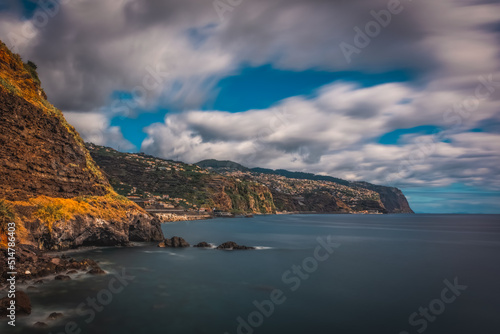 Panoramic view from Ponta do Sol village on Madeira island, Madeira, Portugal. October 2021. Long exposure picture. photo