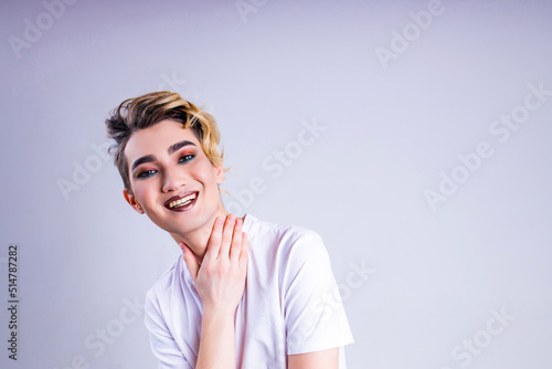 self acceptance gentle lovely man with makeup hug own body in studio white background