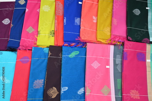 Display of Indian Sarees, Colorful Fancy Sarees in Saree Store, ready to be sell in market.  photo