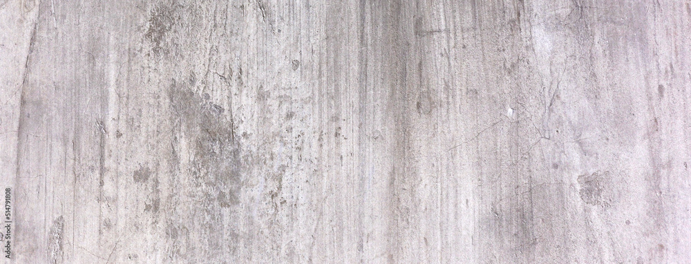 Old dirty concrete wall as a background. Gray cement plaster. Wall texture for background. Brush scratches on the wall