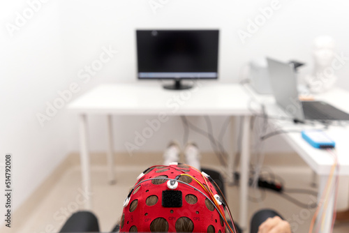 Headgear of a girl controlling the impulse signals during a biofeedback session