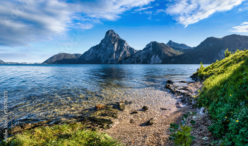 Peaceful autumn Alps mountain lake. Morning panoramic view to Traunsee lake and Traunstein mountain in far, Upper Austria. photo