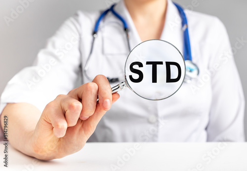 Tableau sur toile STD acronym, medical disease through magnifier