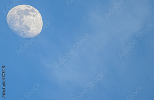 Daytime Moon in clear blue sky 