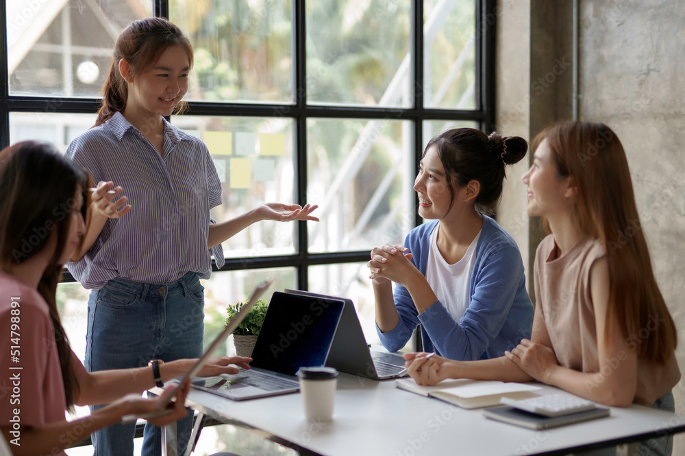 Fototapeta premium Young creative Asian business woman meeting to plan to work together with new business startup.