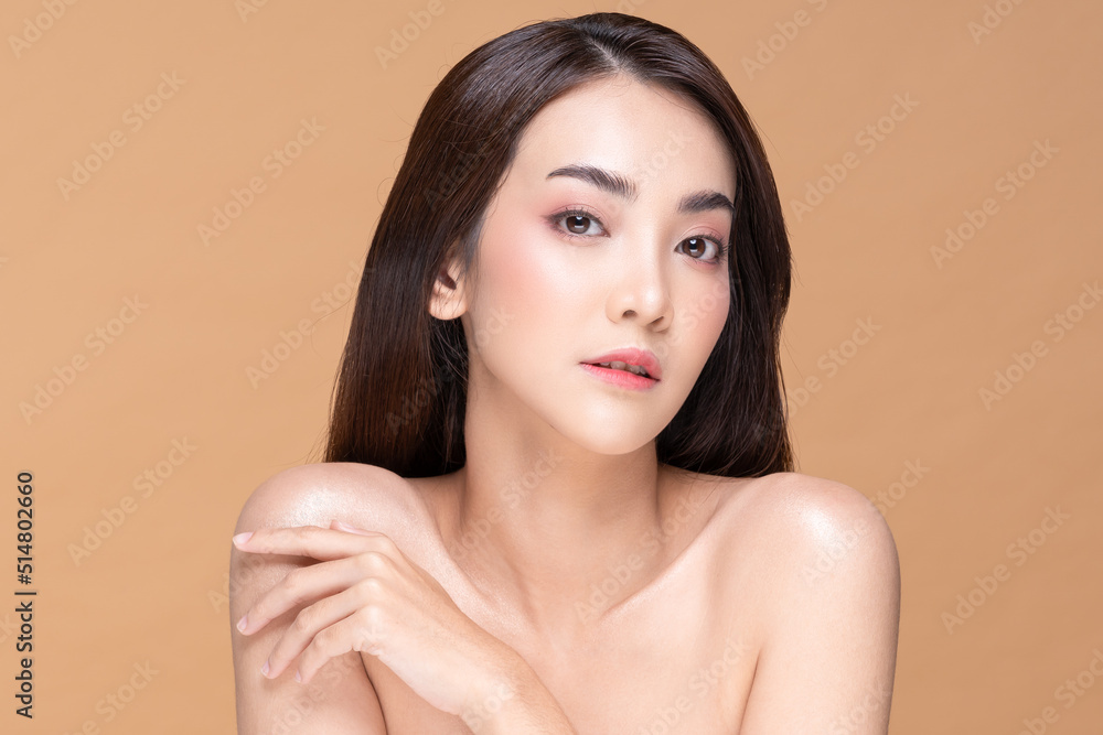 Beautiful Asian woman smile with clean and fresh skin Happiness and cheerful with positive emotional,isolate on Beige background. Young female proud with her beauty skin.Beauty Cosmetics and Self care Beautiful Asian woman smile with clean and fresh skin Happiness and cheerful with positive emotional,isolate on Beige background. Young female proud with her beauty skin.Beauty Cosmetics and Self care