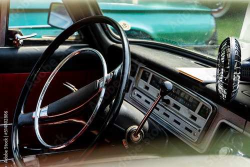 Interior view of old vintage car. View on dashboard of classic car © Pavel