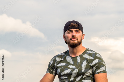 Handsome Young caucasian men, man with stubble beard, Portrait of smiling,  s wearing grey shirt in the countryside, on gray background, nature, sexy men bodybuilder, summer day, Blond ginger © Victoria Moloman