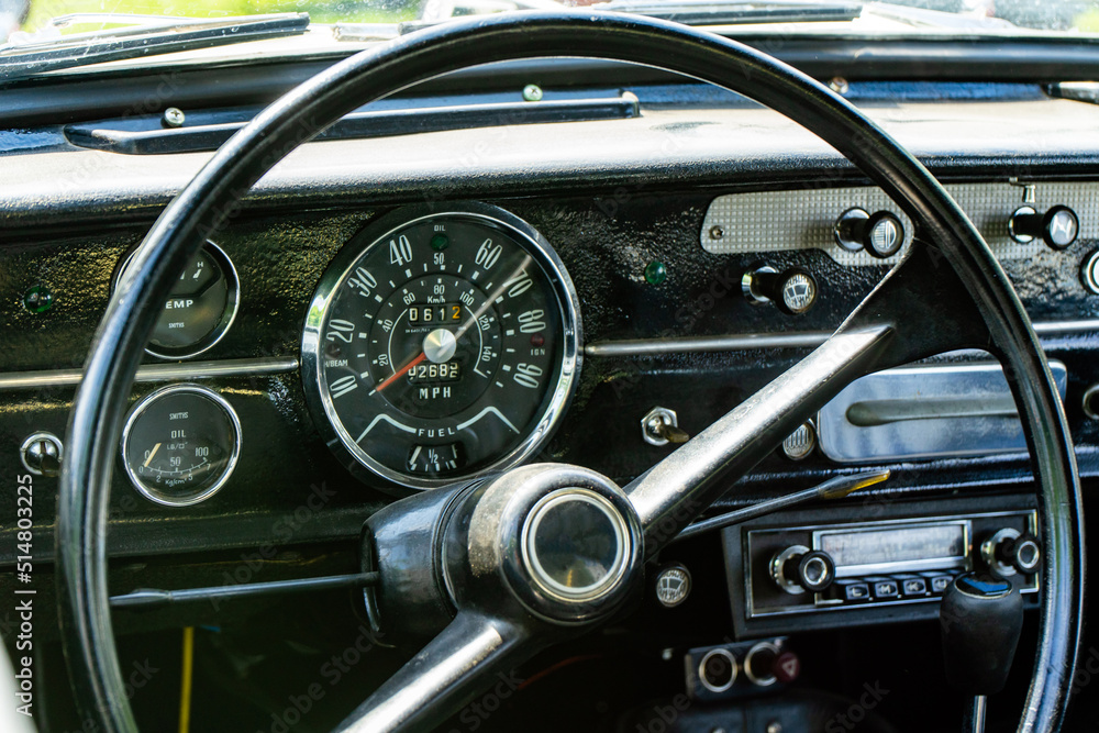 Interior view of old vintage car. View on dashboard of classic car