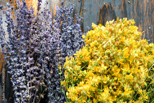 Wild flowers on wooden background close up. High quality photo