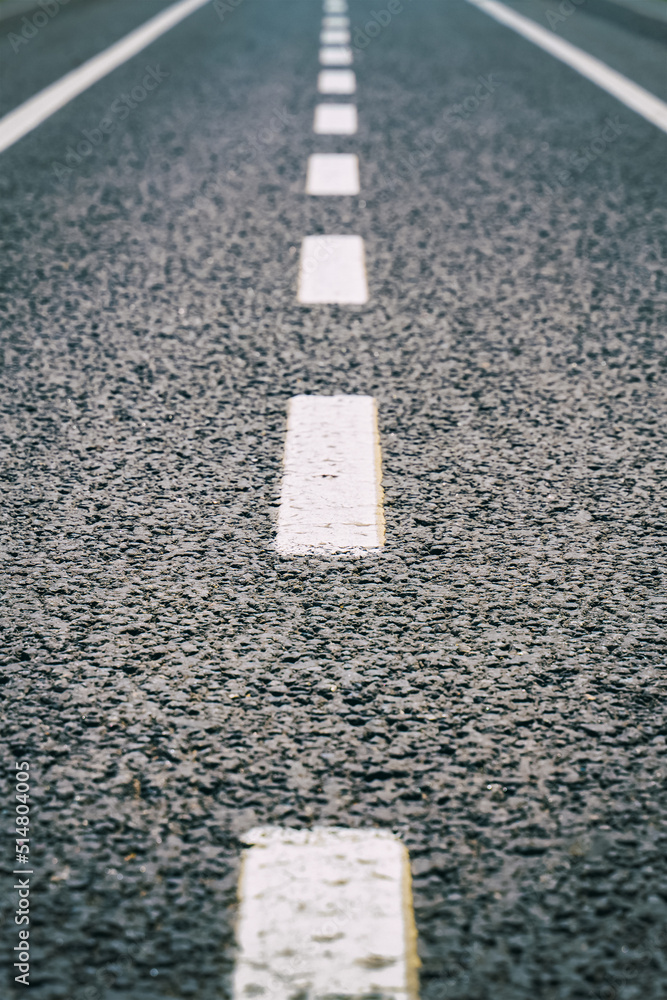 Fototapeta premium asphalt road markings white line, broken line traffic indicator