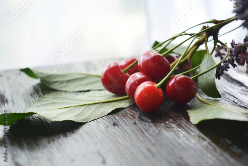 Fresh red cherries fruit on wooden background close up. High quality photo