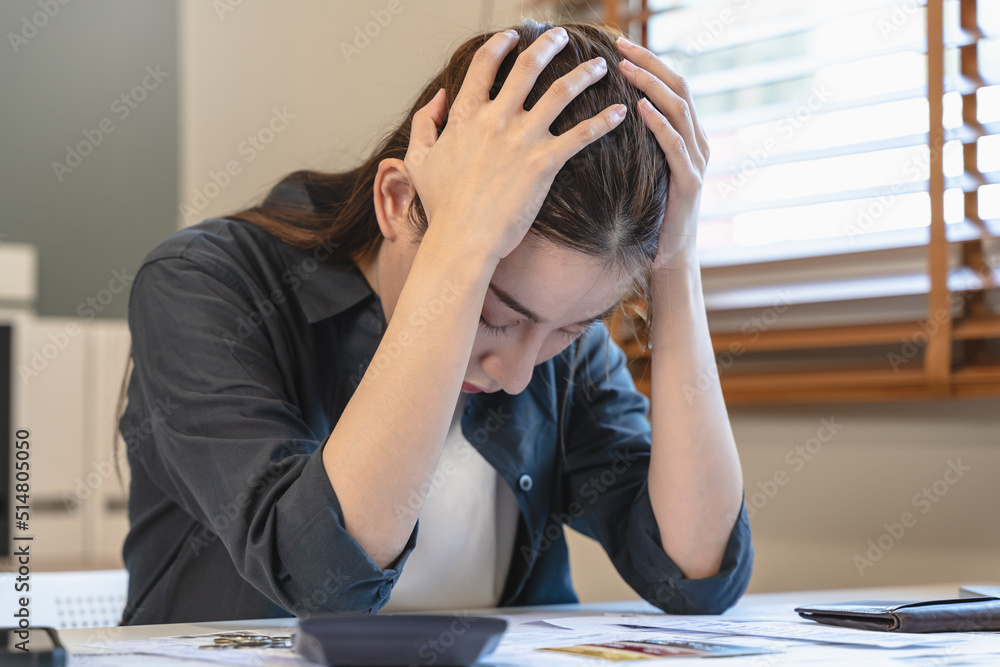 stressed young asian woman trying to find money to pay credit card debt. stressed young asian woman trying to find money to pay credit card debt.