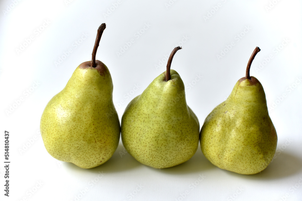 Three green juicy pears on a white background Three green juicy pears on a white background