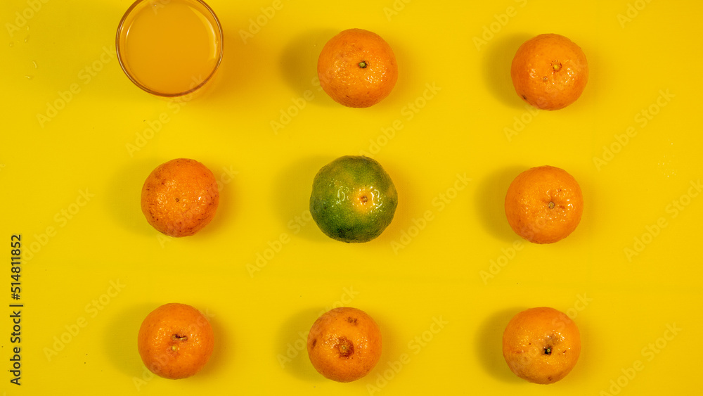 Fototapeta premium the composition of citrus fruits and glass of syrup made from fresh orange juice to drink in depok, West Java on July, 2022