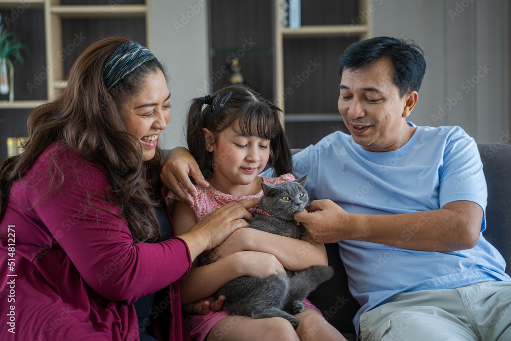 Happy family with cute cats resting at home,Family with cats.