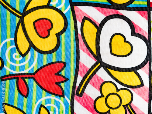 Original fabric background, with drawings of flowers and hearts.