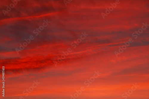 Dramatic red sunset sky background, impressive beauty in nature © okostia