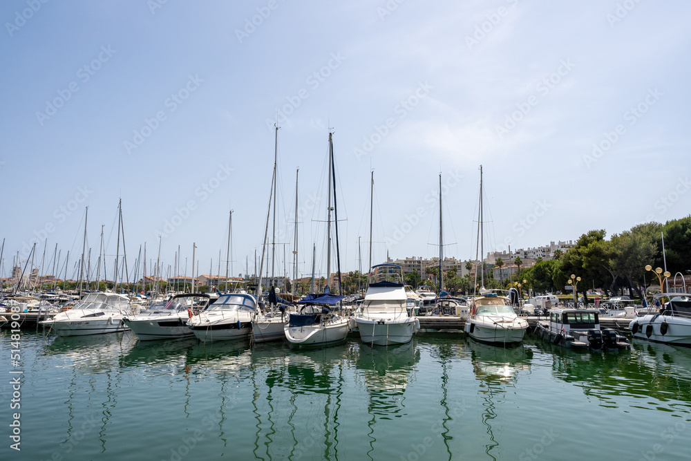 Sleek and modern sailboats and motor boats in a central marina in Antibes, France. Yachts and speed boats in the port.