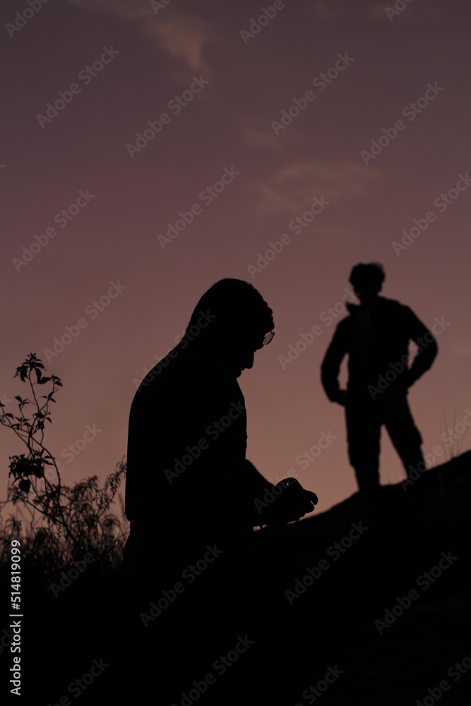 silhouette of photographer and model